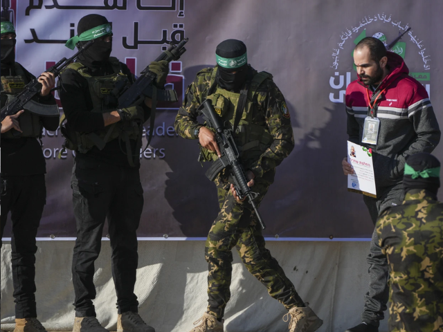 Israeli Yarden Bibas, 34, who has been held hostage by Hamas in Gaza since October 7, 2023, is escorted by Hamas fighters before being handed over to the Red Cross in Khan Younis, southern Gaza Strip, Saturday Feb. 1, 2025. Photo/Abdel Kareem)